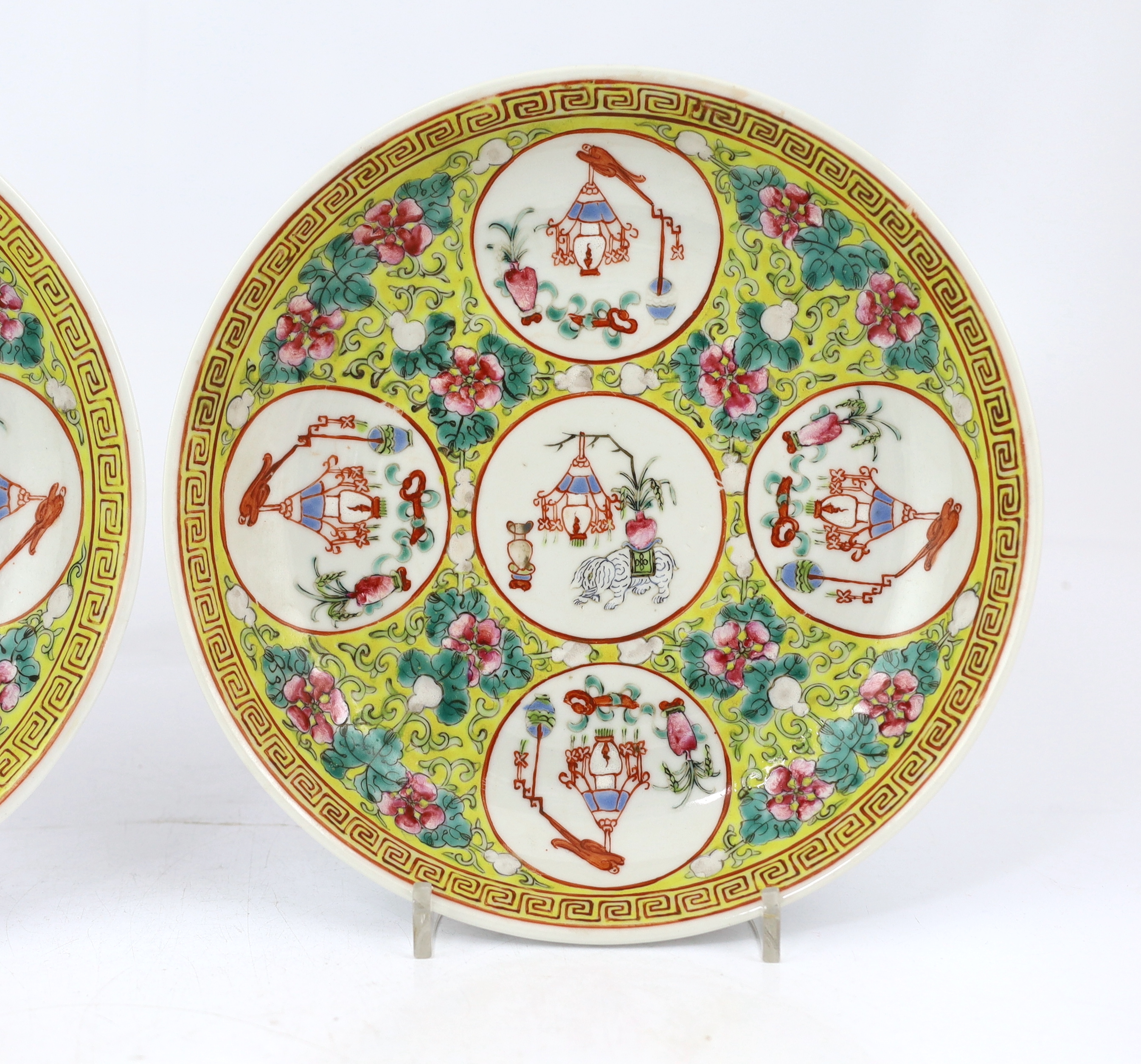 A pair of Chinese yellow ground medallion saucer dishes, Guangxu six character marks, early 20th century, hairline crack to one dish